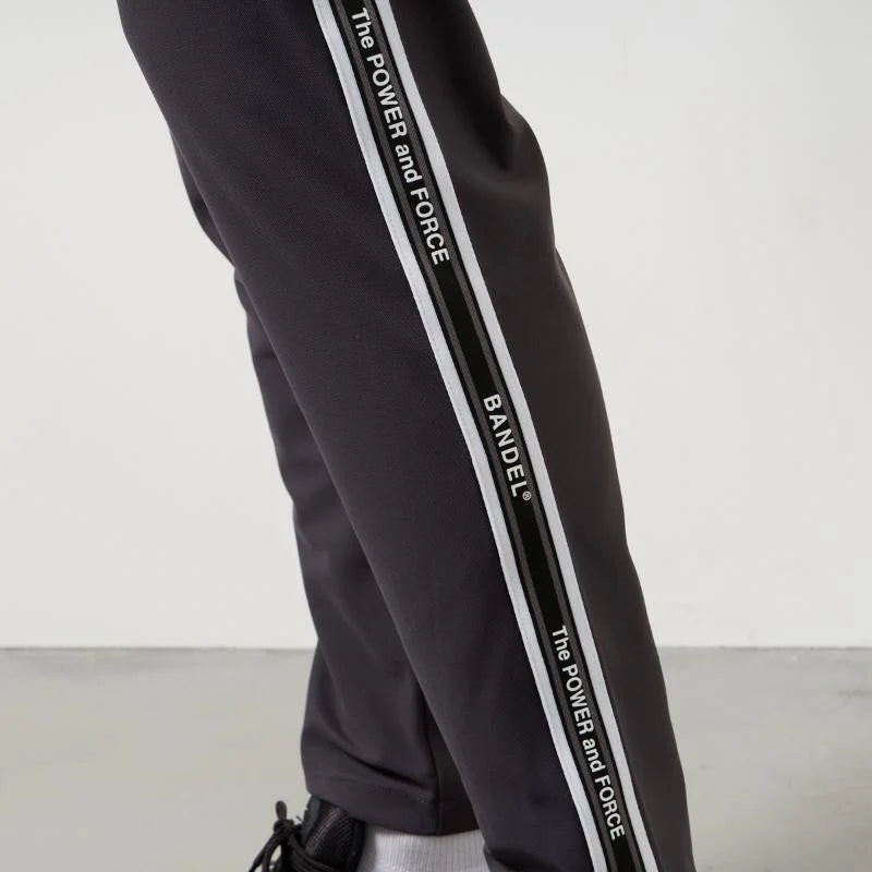 BANDEL GOLF コンセプトノーツテーピングテーパードパンツ CHARCOAL GRAY