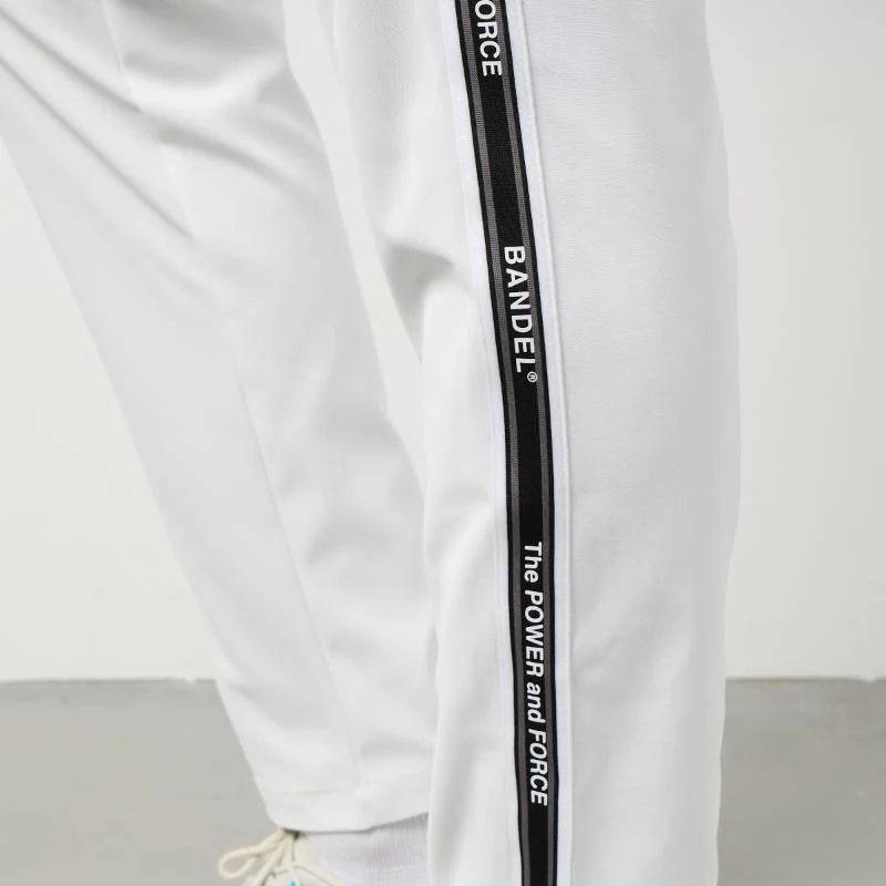 BANDEL GOLF コンセプトノーツテーピングテーパードパンツ WHITE