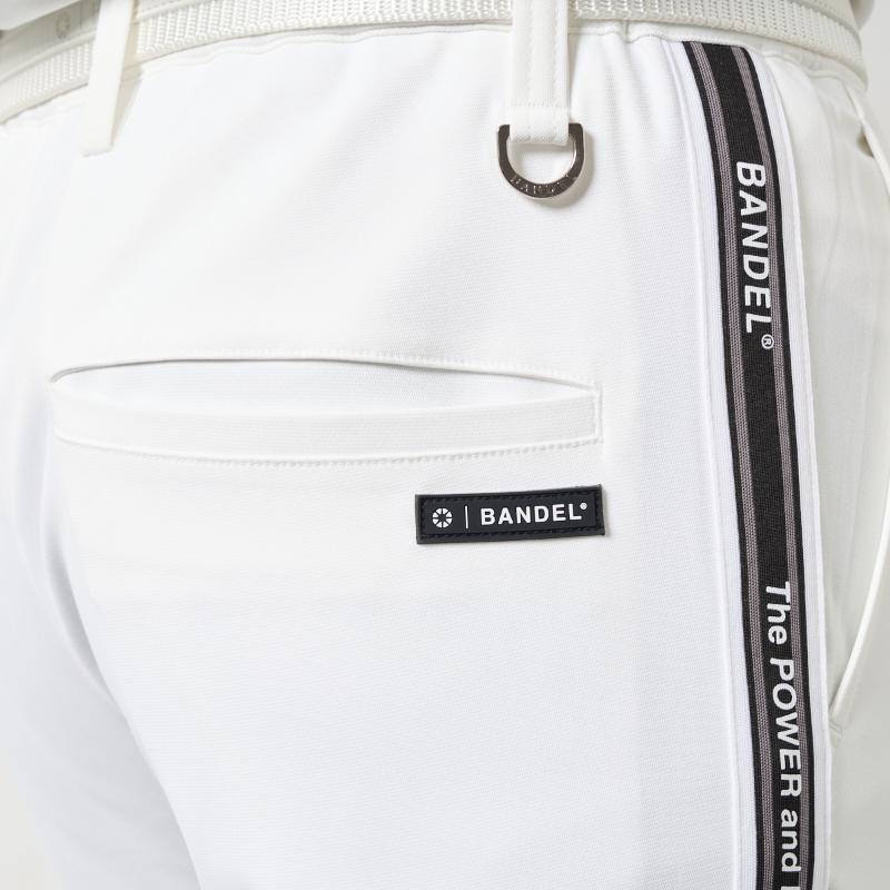 BANDEL GOLF コンセプトノーツテーピングテーパードパンツ WHITE