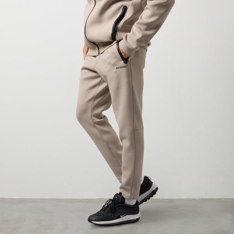 TECH FLEECE PANTS BNS-4ATFPT ベルトループ ドローコード 脚長効果 ストレッチ セットアップ / BEIGE
